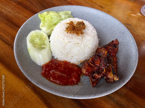 a plate of rice with sweet roasted duck