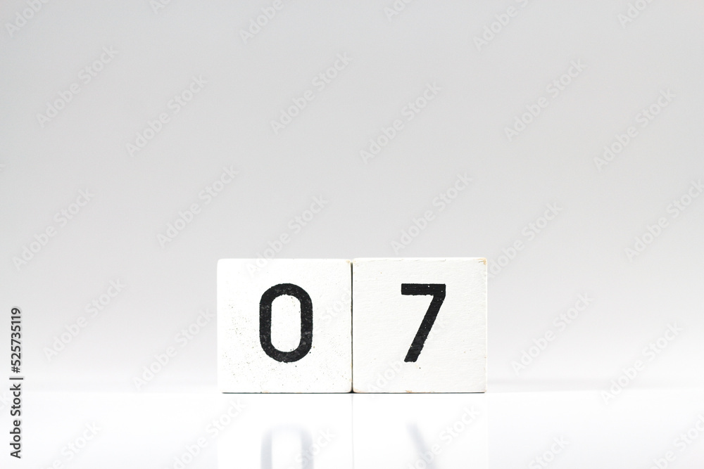 White wooden block with number 07 with reflection isolated on white background White wooden block with number 07 with reflection isolated on white background