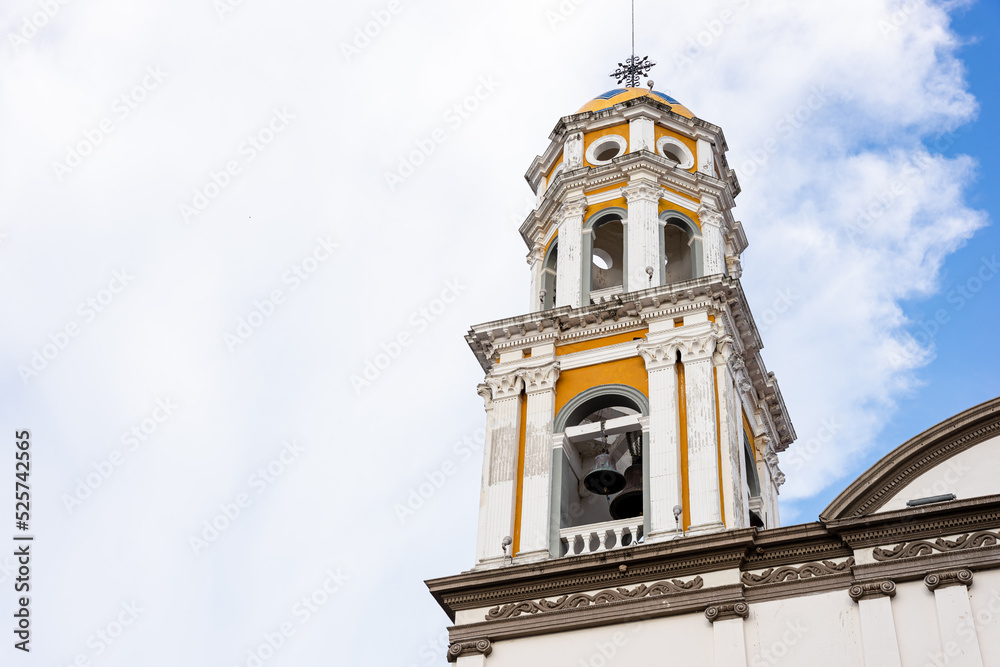 Bell tower in the center of the park in the magical town of Comala in Colima, Mexico, white town, copy space