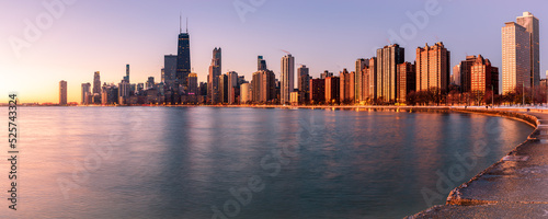 Panoramic view of Chicago skyline at sunrise.