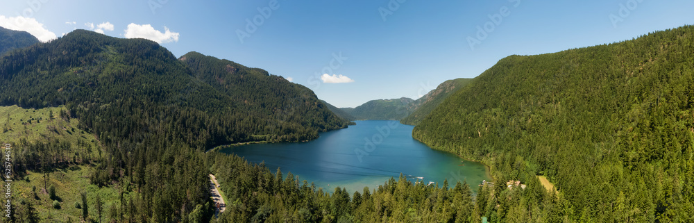 Fototapeta premium Aerial Panoramic View of Cameron Lake during a vibrant sunny day. Vancouver Island, British Columbia, Canada. Canadian Nature Background