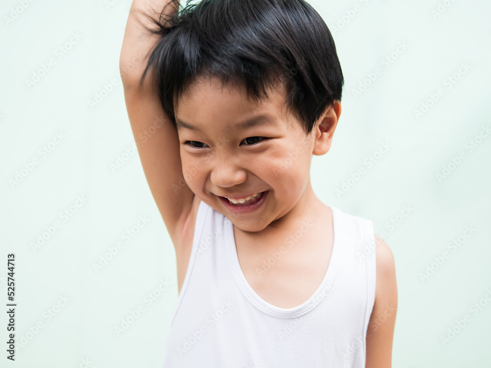 Asian cute little child boy smiling with whitening teeth. Happy Kid in white shirt enjoy in funny time in relaxing day. Concept of success, freedom, happiness, expression, education. Asian cute little child boy smiling with whitening teeth. Happy Kid in white shirt enjoy in funny time in relaxing day. Concept of success, freedom, happiness, expression, education.