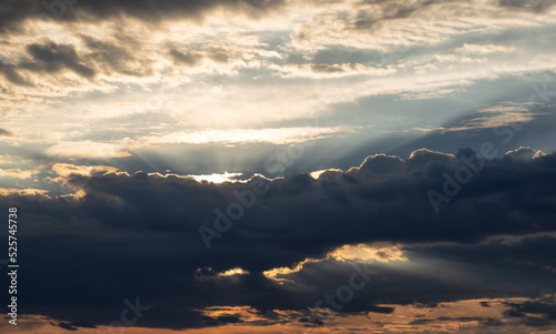 Dark Dramatic Cloudy Cloudscape with Sunrays. Sunrise or Sunset. Nature Background. Taken in BC, Canada.