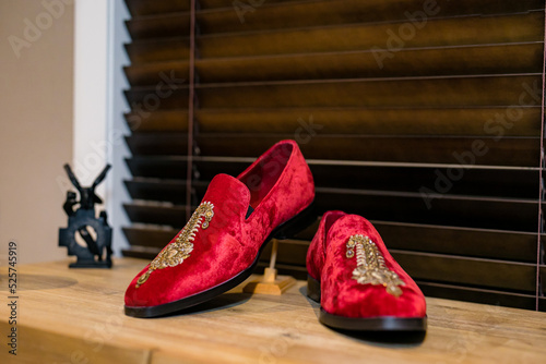 Indian Punjabi groom's red wedding shoes close up
