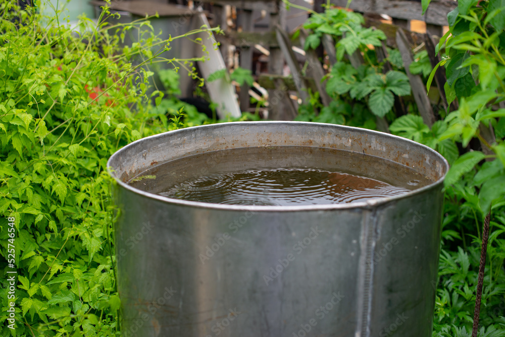 a water tank stands on the lawn