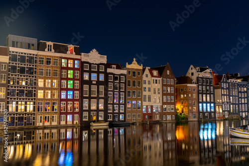 amsterdam damrak canal at night