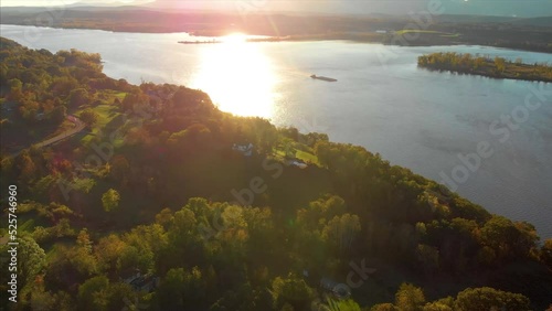 Drone shot of Hudson valley river in upstate new york with green trees and forest in a sunset 4K UHD 3840