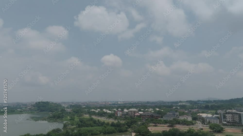 AERIAL - Jabi Lake Reservoir in Abuja, Nigeria, Africa, reverse lowering reveal AERIAL - Jabi Lake Reservoir in Abuja, Nigeria, Africa, reverse lowering reveal