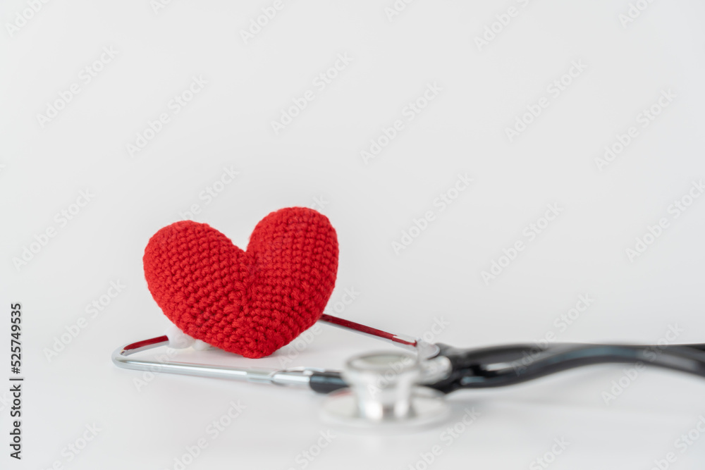 Stethoscope and red heart on white background concept of health care and medical Stethoscope and red heart on white background concept of health care and medical