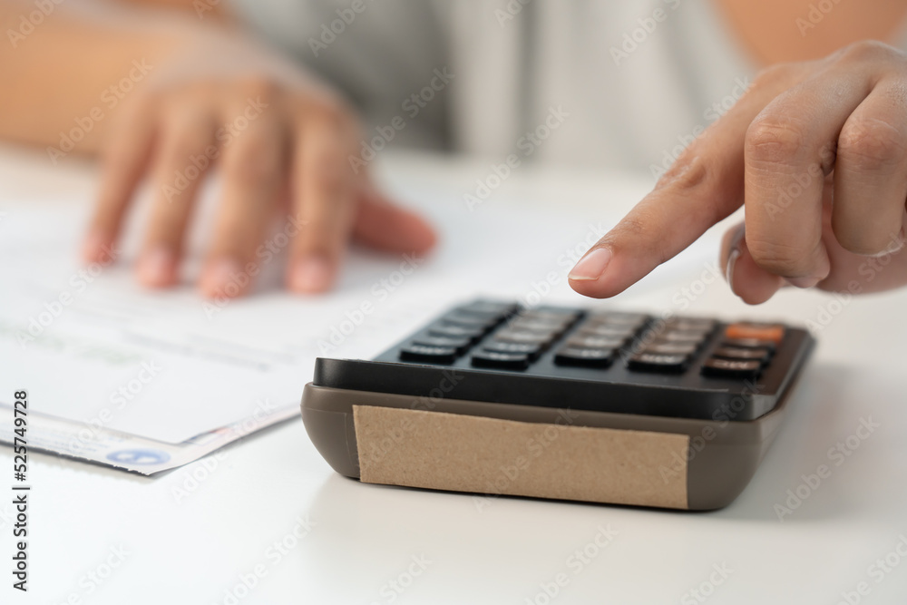 Woman working on financial bill paper document doing home accounting Woman working on financial bill paper document doing home accounting