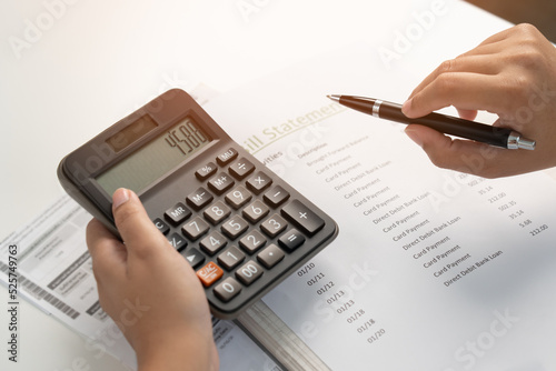 Woman working on financial bill paper document doing home accounting