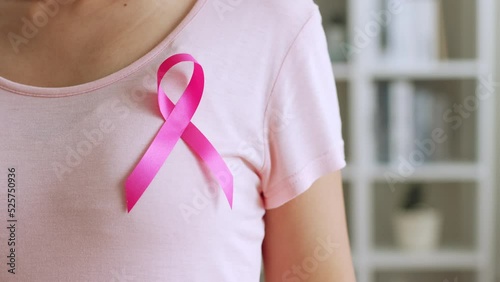 Wallpaper Mural Woman show pink ribbon as sign of October Breast Cancer Awareness month Torontodigital.ca