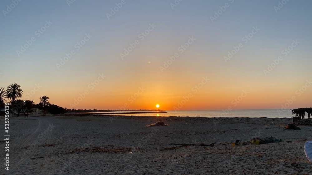 orange sunrise cloudless sky on island of Djerba