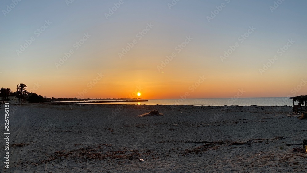 orange sunrise cloudless sky on island of Djerba