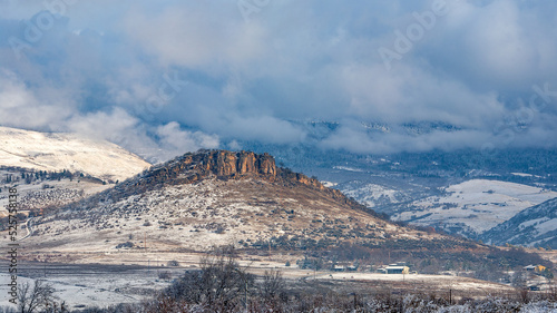Snow-dusted butte seen from across the Rogue Valley in the southern end of Ashland, Oregon photo