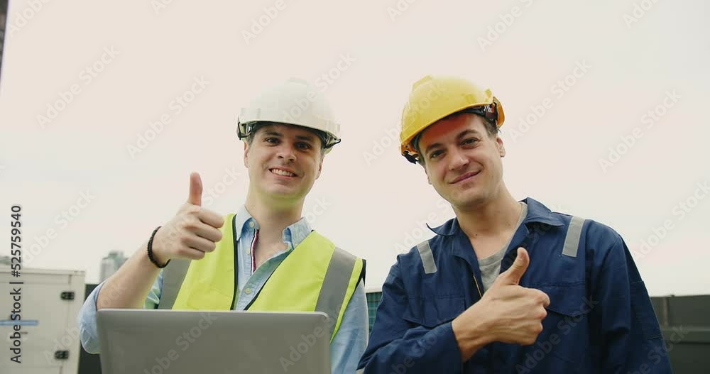Portrait handsome Caucasian civil engineer Construction manager and manual worker inspector foreman in safety helmet looking at camera showing thumbs up and Smiling at construction site Portrait handsome Caucasian civil engineer Construction manager and manual worker inspector foreman in safety helmet looking at camera showing thumbs up and Smiling at construction site