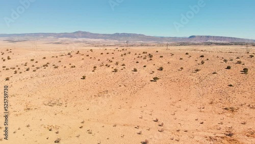Top angle aerial view desert New Mexico Drone shot of western sand dunes and mountains with blue clear cloudless sky and brush steppe 4K UHD 3840