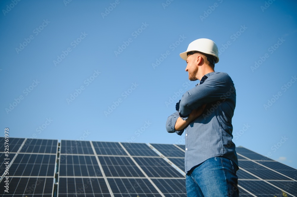 Solar power plant. Engineer on a background of photovoltaic panels. Science solar energy. Solar power plant. Engineer on a background of photovoltaic panels. Science solar energy.