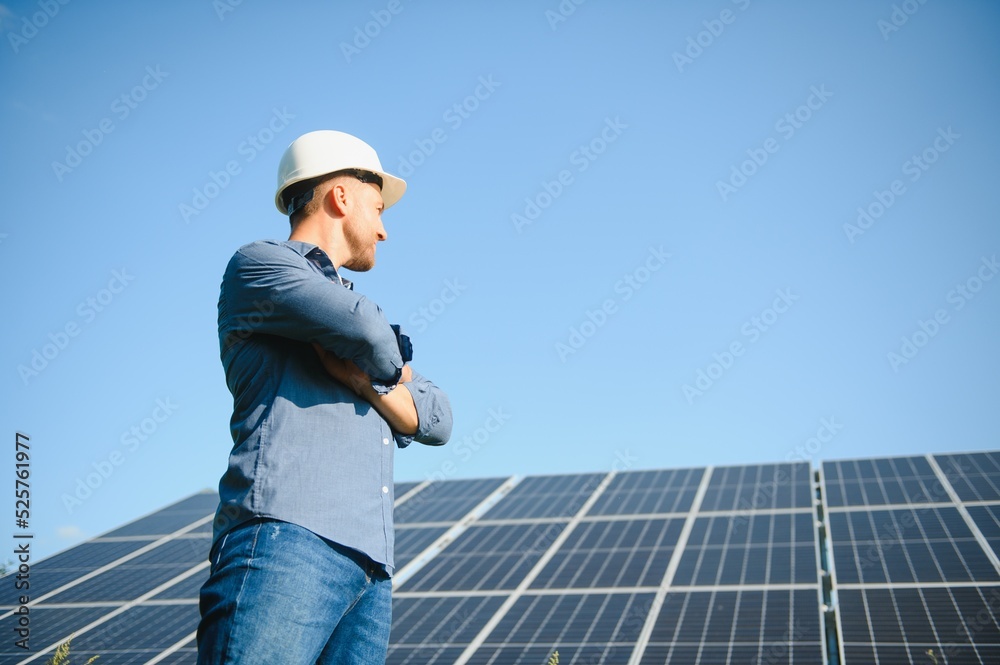 The solar farm(solar panel) with engineer check the operation of the system, Alternative energy to conserve the world's energy, Photovoltaic module idea for clean energy production The solar farm(solar panel) with engineer check the operation of the system, Alternative energy to conserve the world's energy, Photovoltaic module idea for clean energy production