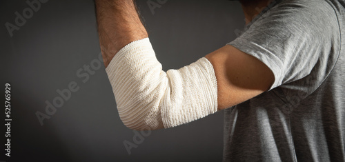 Bandage on elbow. First aid and medicine concept © andranik123