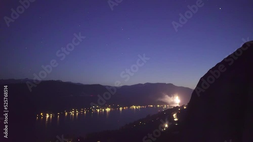 wide shot looking down at fireworks lighting up the night sky over donner lake in Truckee California during the 4th of July celebration photo