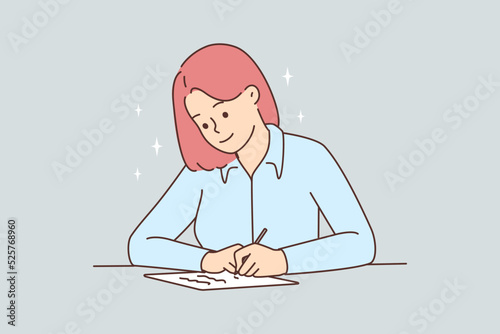 Smiling woman sit at desk writing 