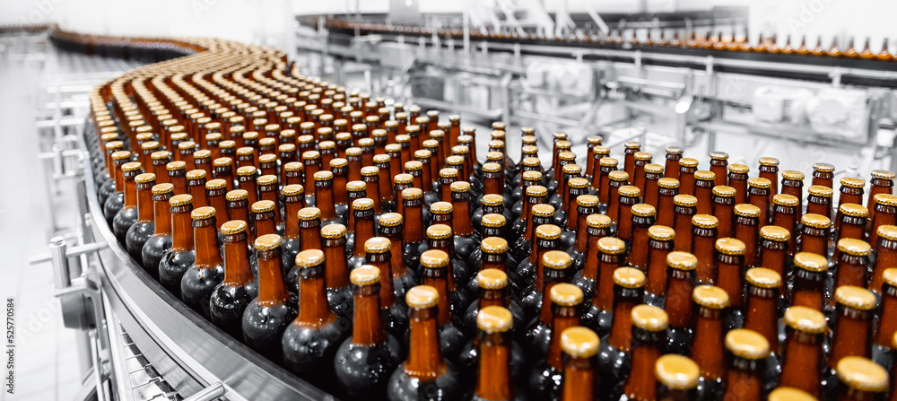 Brown glass beer drink alcohol bottles, brewery conveyor, modern production line