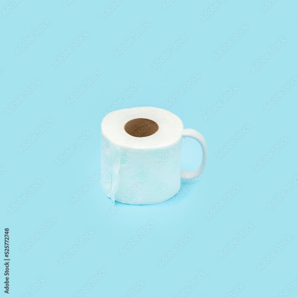 Toilet paper rolls like a cup on Blue background. Creative minimal concept. Toilet paper rolls like a cup on Blue background. Creative minimal concept.