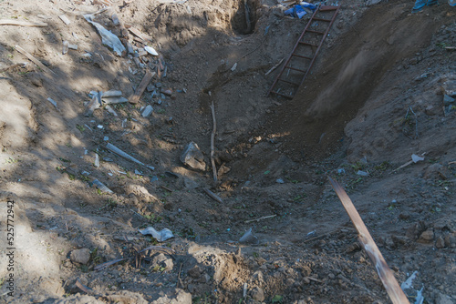 Remains of a private house in the city of Dnipro. Consequences of a rocket explosion. Funnel after a rocket hit a residential building. War in Ukraine