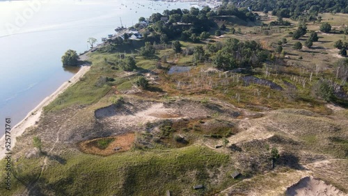 Aerial push toward the Sand Dunes on the Coastline of Muskegon Lake. photo