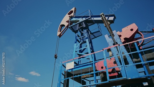 oil pump. oil rig mechanism pumping oil and gas. business sunlight industry concept. rig energy petroleum barrel. oil pump pumps from the ground business finance concept
