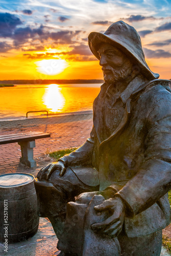 Sculpture of a fisherman at the yacht harbor. Nowe Warpno, West Pomeranian Voivodeship, Poland.