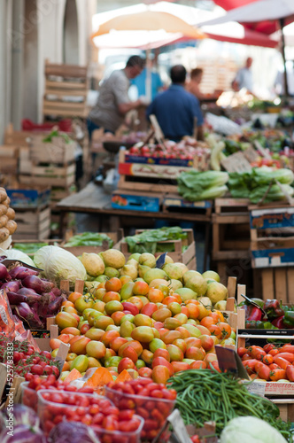 Vegetable stall at the Catania market with tomatoes, cucumbers Etal de maraîcher au marché de Catane avec tomates, concombres, aubergines, courgettes et beaucoup de légumes et fruits © JeanMichel
