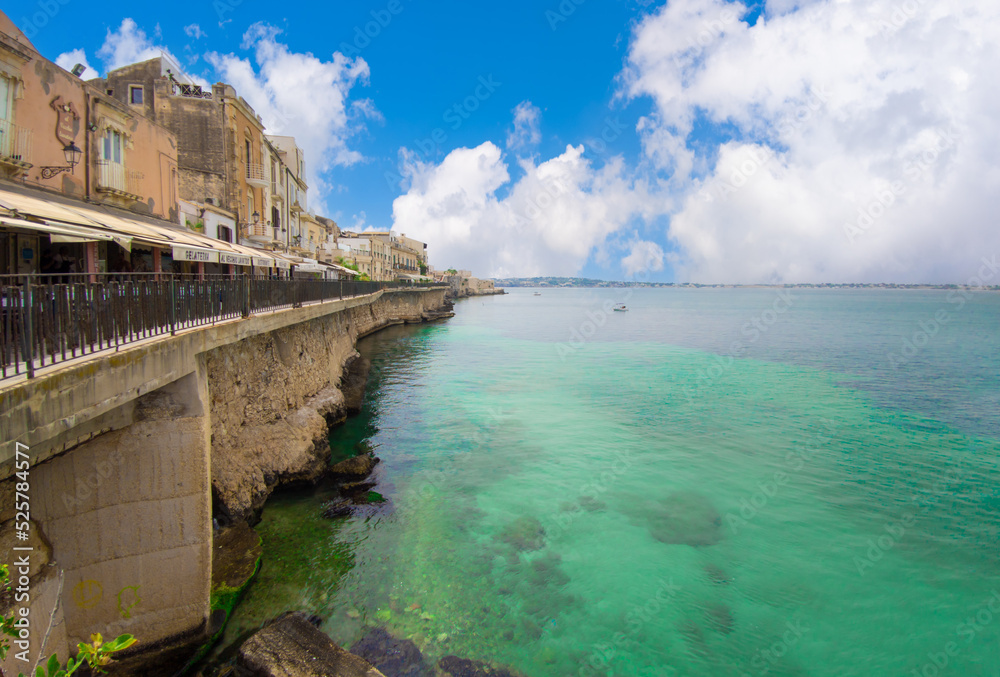 Ortigia island of Siracusa (Sicilia, Italy) - A historical center view of the touristic baroque island in the municipal of Siracusa, Sicily, during the summer; UNESCO site, with castle and old church