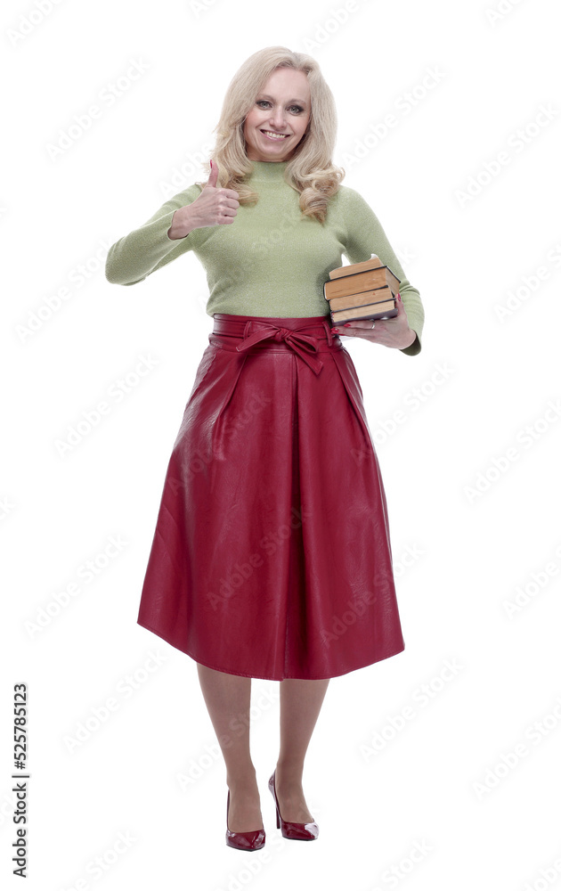happy woman with a stack of books giving a thumbs up happy woman with a stack of books giving a thumbs up
