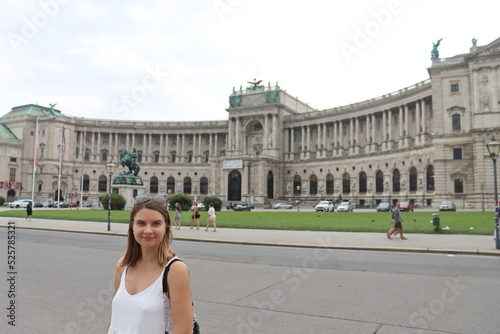 a young European-looking girl poses on Maria Theresa Square in Vienna