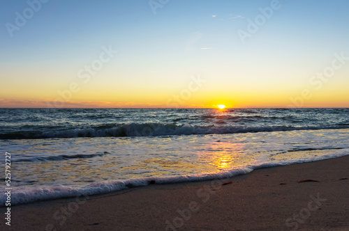 Wallpaper Mural Sunset over the sea. Reflection of sunlight in the sea waves. The sky in the sunset rays. Torontodigital.ca