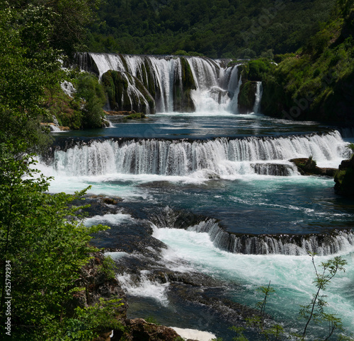 a magnificent waterfall called strbacki buk on the beautifully clean and drinking Una river in Bosnia and Herzegovina in the middle of a forest.