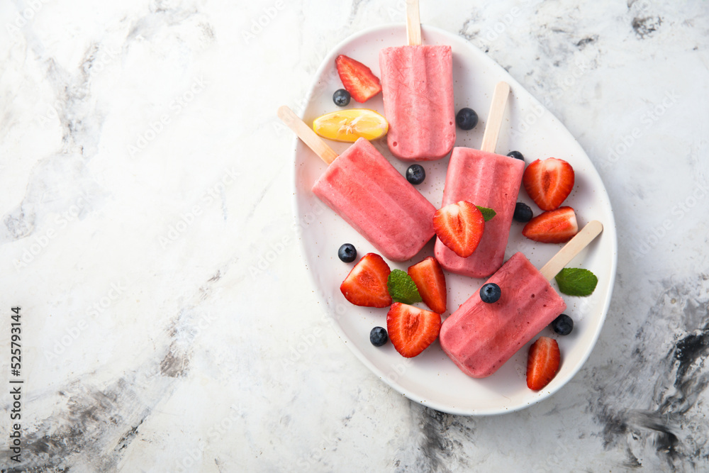 Traditional homemade berry popsicles on a plate