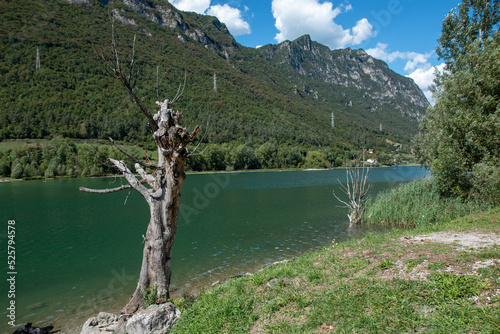 idro lake alpine water basin at the foot of the alpine peaks photo