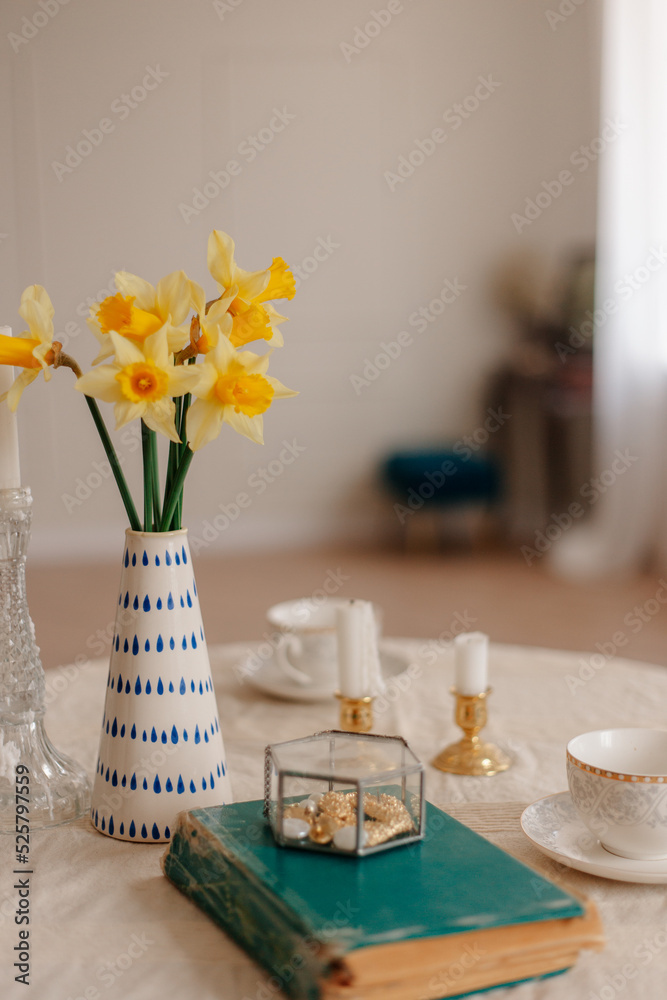 bouquet of flowers in vase on table with candles bouquet of flowers in vase on table with candles