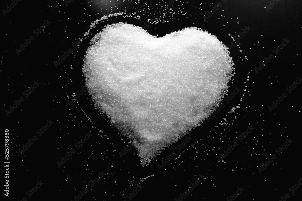 Abstract photo with image of heart made of white sugar on dark background as symbol of love Abstract photo with image of heart made of white sugar on dark background as symbol of love
