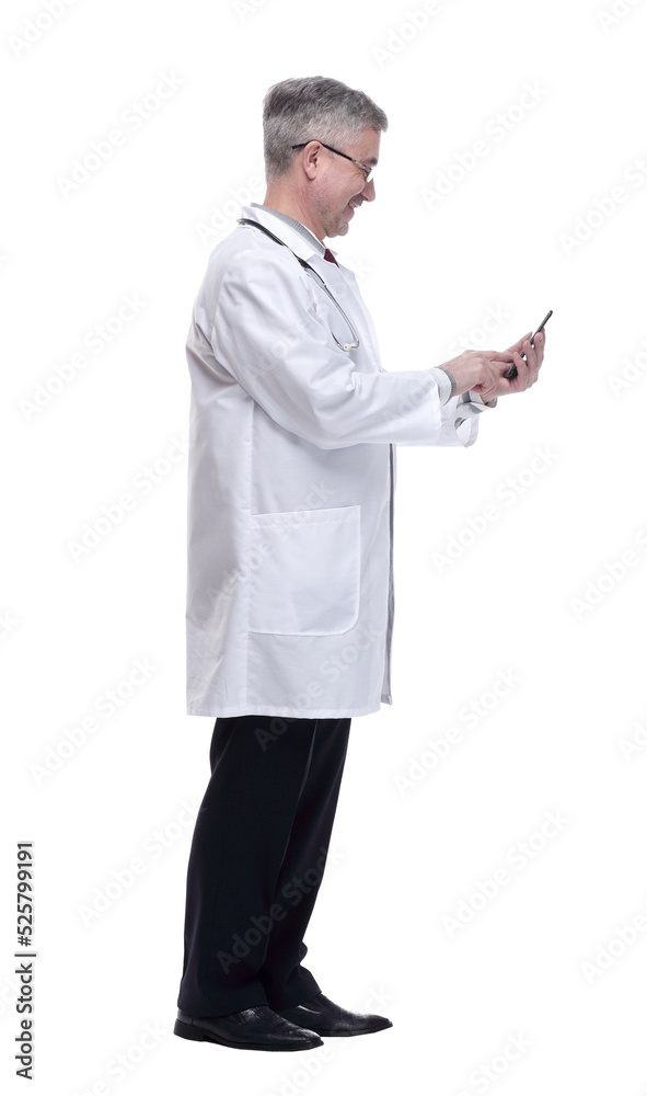 smiling doctor with smartphone looking forward. isolated on a white smiling doctor with smartphone looking forward. isolated on a white