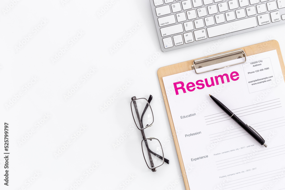 Resume application form on office table. Find new job concept Resume application form on office table. Find new job concept