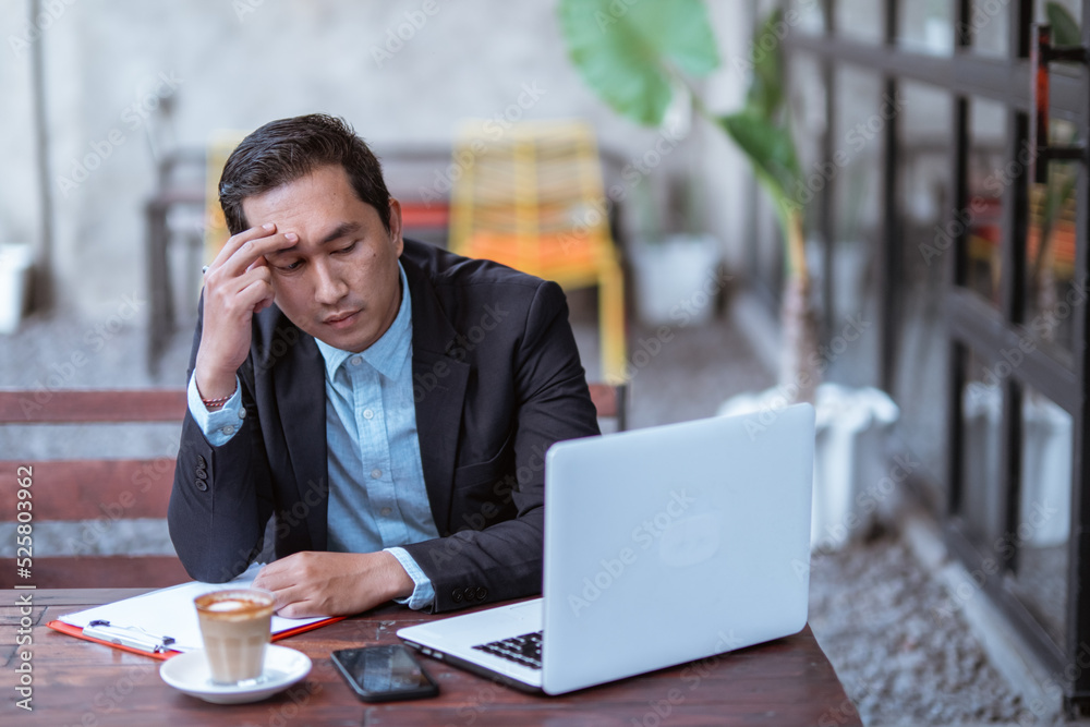 frustrated young businessman while working with his laptop outdoor frustrated young businessman while working with his laptop outdoor