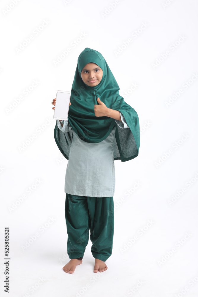 Indian little girl showing smartphone on white background.