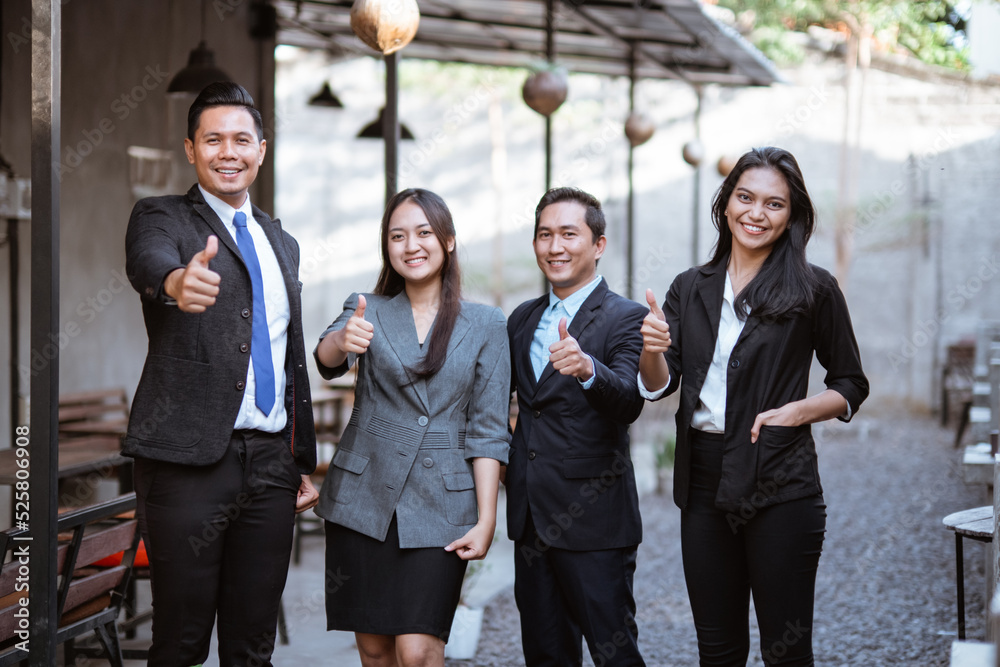 portrait asian business partner showing thumb up gesture to camera portrait asian business partner showing thumb up gesture to camera