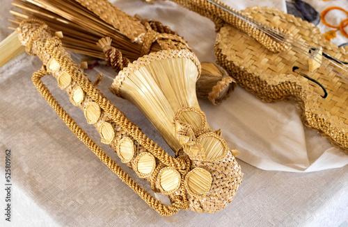 Saxophone and violin made of straw. Handmade, tradition. Close-up photo