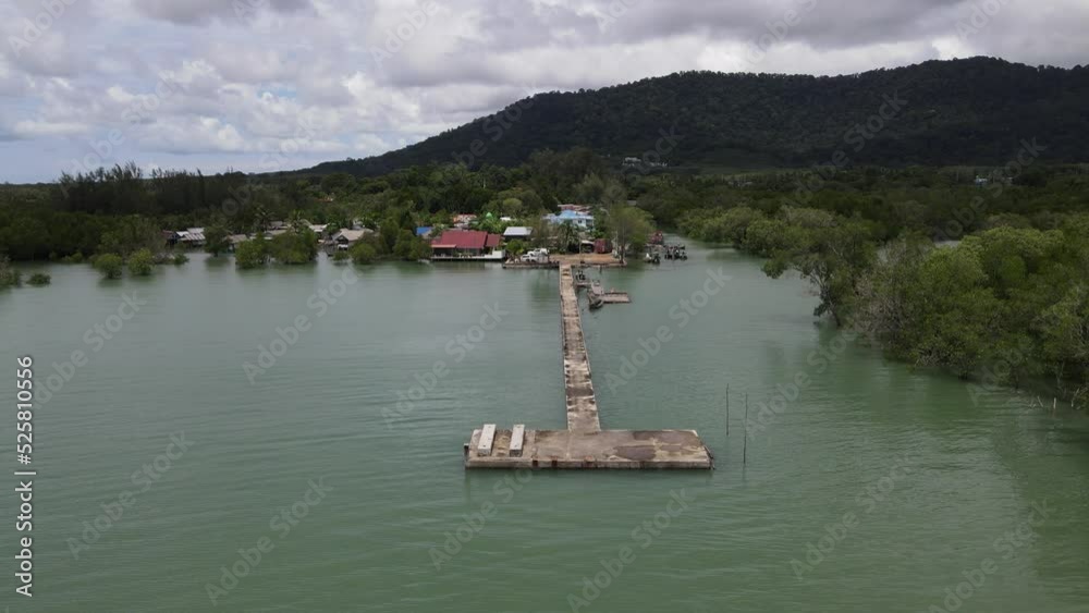aerial view bridge in small pier a village with a beautiful mountain backdrop in Phuket. aerial view bridge in small pier a village with a beautiful mountain backdrop in Phuket.