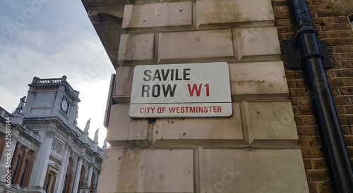 LONDON, UNITED KINGDOM, FEBRUARY 26, 2022 - Savile Row street sign in London, City of Westminster where the Beatles played the last concert, the rooftop concert, on January 30th, 1969 photo